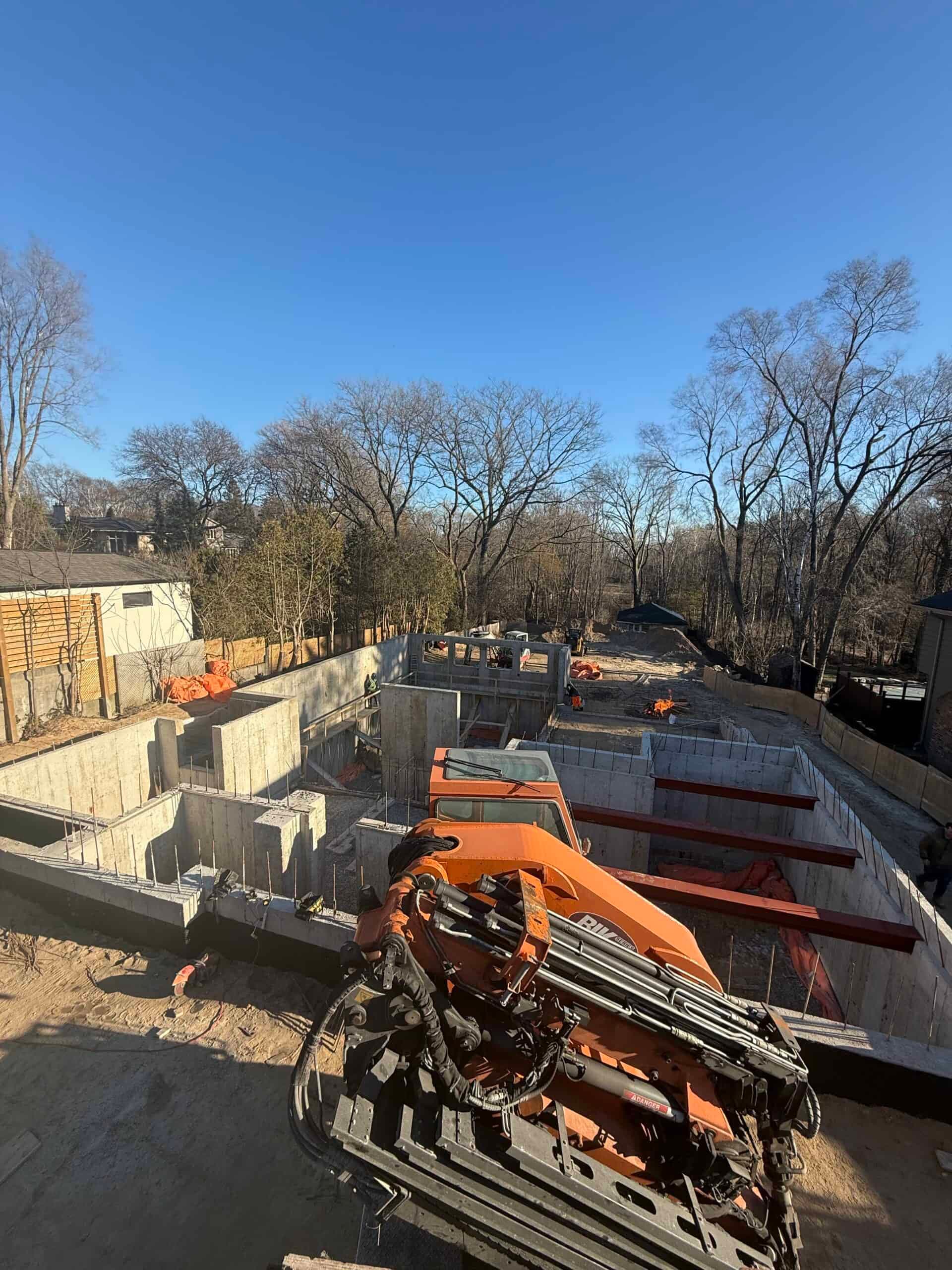 Luxury home with basketball court in lower foundation. Walls reaching 16 feet in height
