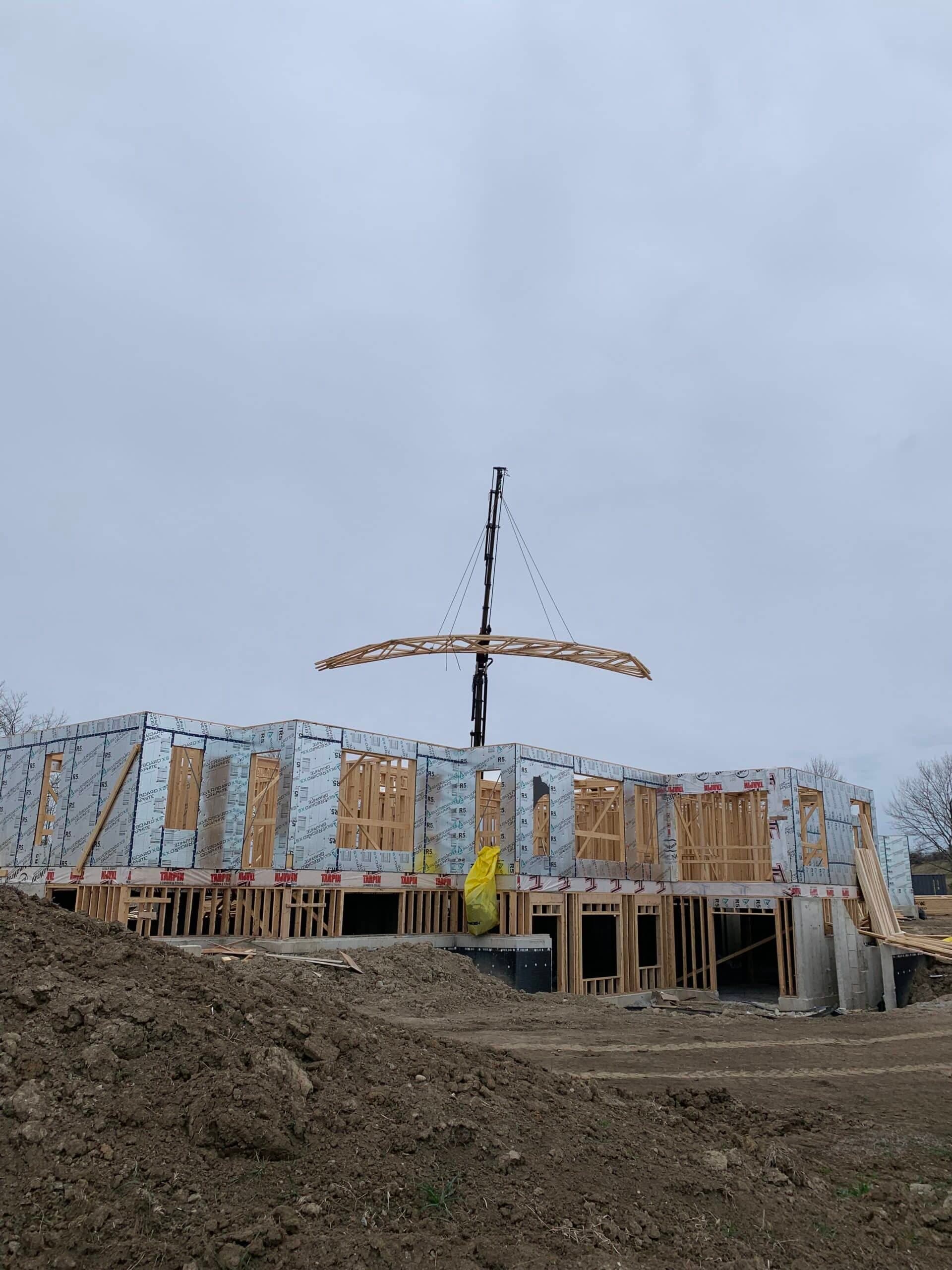 Crane service for lifting roof trusses. Moved 1200lbs of trusses 80 feet back from delivery location
